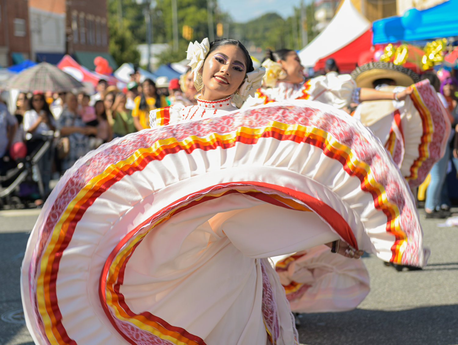 A Balet Folklorico dancer enchants the eye of the camera at The Hispanic Heritage Festival.